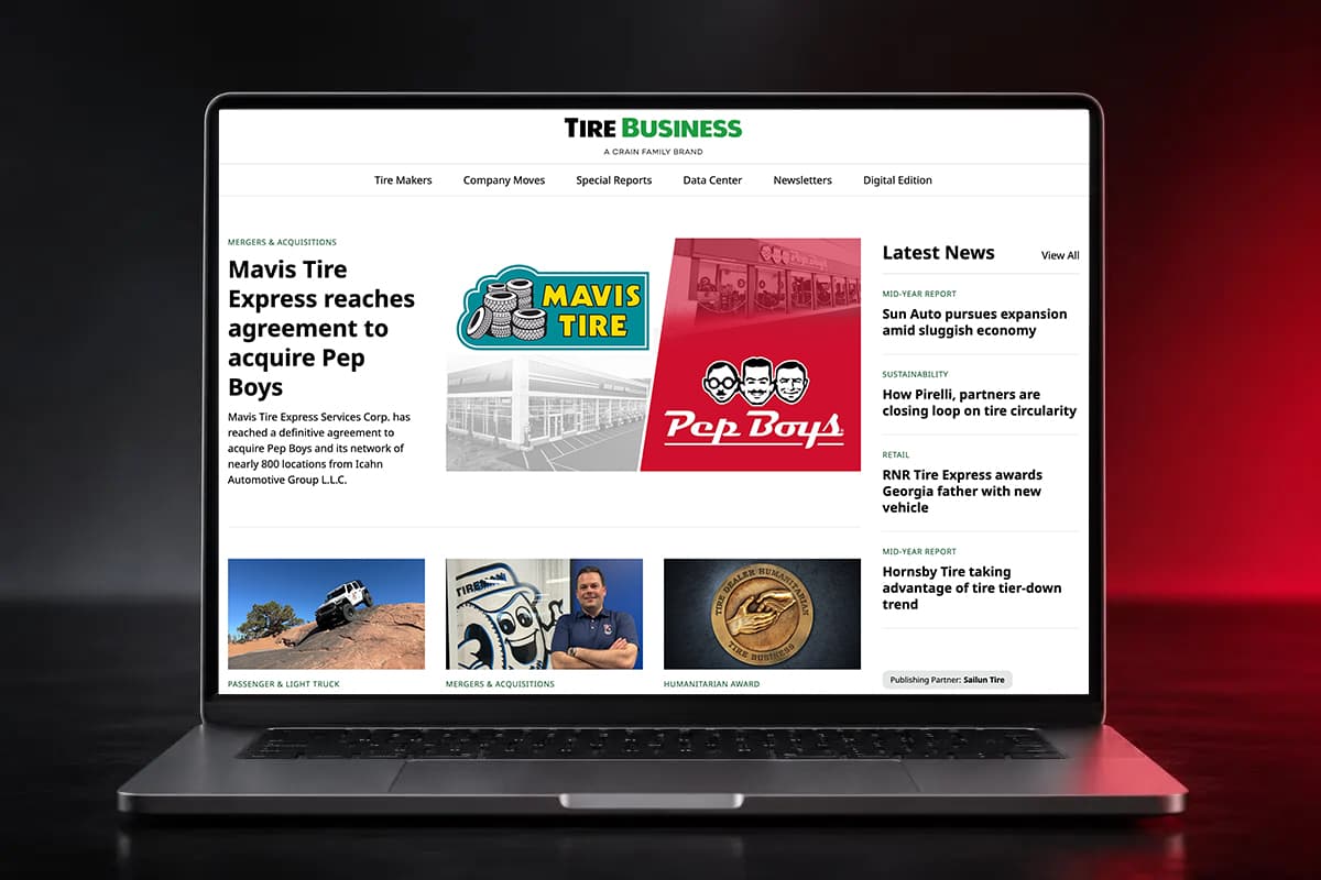 The Tire Business homepage on a laptop